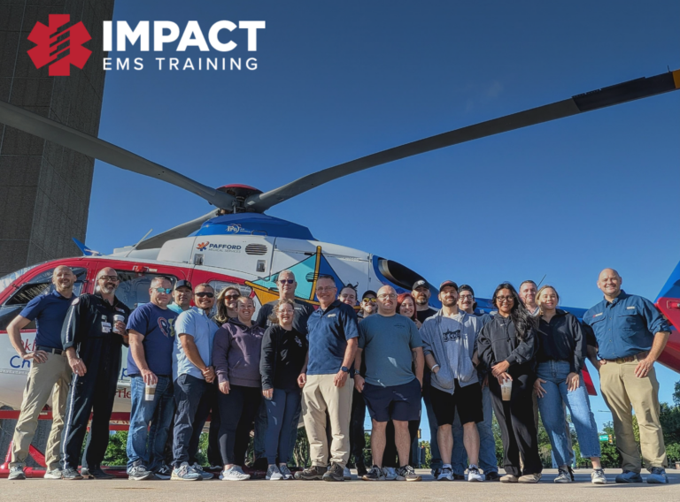 group of people standing in front of helicopter